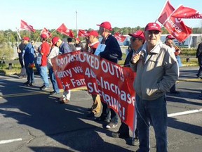 Taxi drivers protest on the Airport Parkway Tuesday.