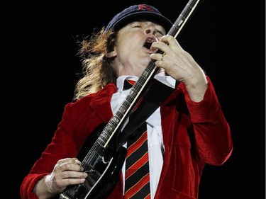 Angus Young, lead guitarist of AC/DC, the thunder from down under.