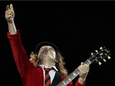 Angus Young, lead guitarist of AC/DC, the thunder from down under.