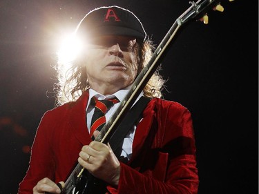 Angus Young, lead guitarist of AC/DC, the thunder from down under.