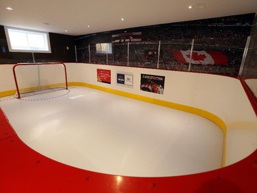 A 25-by-15-foot artificial rink, complete with NHL boards, glass and gate — courtesy of SmartRink — can handle ice skates and is perfect for practising your shot. The wall mural of fans in the stands was supplied by the Ottawa Senators.