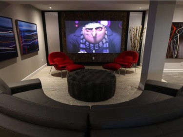In keeping with the open party space Correy wanted in the basement, the home theatre is more like a lounge. A 120-inch projection screen from Signature Audio Video is new on the market. Hung on aircraft cables, the frameless acrylic is just an eighth of an inch thick. The cost? About $6,000.