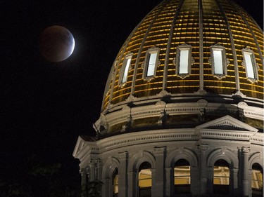 A perigee full moon, or supermoon, is seen during a total lunar eclipse behind The Colorado State Capitol building on September 27, 2015, in Denver, Colorado. The combination of a supermoon and total lunar eclipse last occurred in 1982 and will not happen again until 2033.