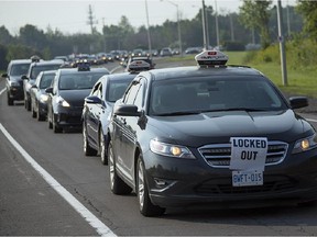 August 18, 2015 - Ottawa airport cab drivers bring their protest out onto the road Tuesday morning, snarling traffic to a halt along the Airport Pkwy.