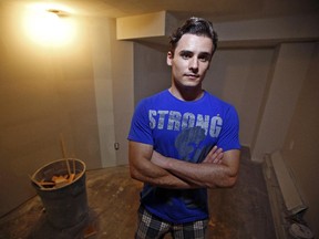 Daniel Chivu stands in the unfinished room he was expecting to be ready for move-in on Fourth Avenue on Tuesday.