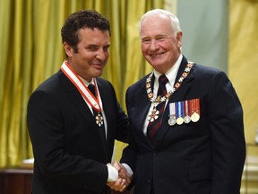 Governor General David Johnston promotes Rick Mercer to a Officer of The Order of Canada to during an investiture ceremony at Rideau Hall in Ottawa on Wednesday, September 23, 2015.
