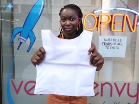 A salesperson at Venus Envy displays the elastic undervest used to flatten the chest that is considered a key 'health support' for people making a gender transition.