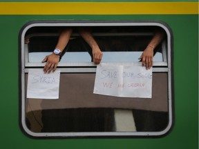 BUDAPEST, HUNGARY - SEPTEMBER 03:  Migrants protest against being taken to a refugee camp from a train that has been held at Bicske station on September 3, 2015 in Bicske, near Budapest, Hungary. Although the station has reopened, all international trains to Western Europe have been cancelled. According to the Hungarian authorities a record number of migrants from many parts of the Middle East, Africa and Asia are crossing the border from Serbia. Since the beginning of 2015, the number of migrants using the so-called Balkans route has exploded with arrivals in Greece from Turkey, and then travelling on through Macedonia and Serbia before entering the EU via Hungary. The massive increase, said to be the largest migration of people since World War II, led Hungarian Prime Minister Victor Orban to order Hungary's army to build a steel and barbed wire security barrier along its entire border with Serbia, after more than 100,000 asylum seekers from a variety of countries and war zones entered the country so far this year.