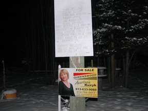 A photographer for the Eganville Leader took this picture Jan. 21, 2011 when a home owned by Basil Borutski and his wife Mary Ann Borutski burned to the ground under suspicious circumstances. It shows a list of Borutski’s perceived enemies and, beneath it, a real estate poster for Anastasia Kuzyk, one of the women Borutski is accused of killing on Tuesday.