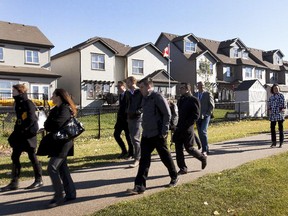 Regional mayors and councillors are examining how to create more affordable housing on October 2, 2014 in Edmonton.  They are seen here touring a new area in Spruce Grove that has been designed in this fashion. (Greg Southam/Edmonton Journal)