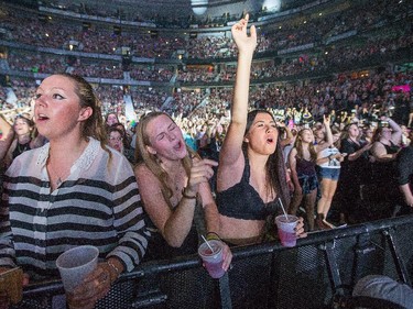 Fans react as the band One Direction takes to the stage at Canadian Tire Centre on Tuesday night.