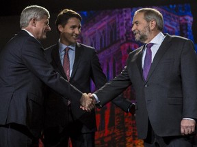 Prime Minister Stephen Harper, left, Liberal leader Justin Trudeau, centre, and New Democratic leader Thomas Mulcair, greet and shake hands before the Globe and Mail Leader's Debate 2015 in Calgary, on September 17, 2015.