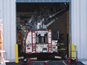 Firefighters drove one truck inside the large building on Stevenage Drive.