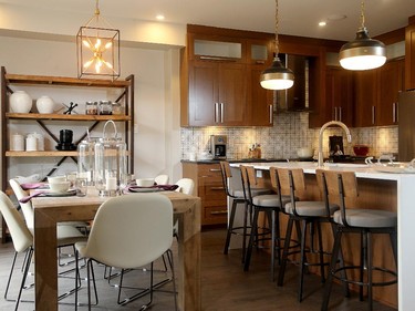 Warm cherry cabinets in a timeless Shaker style are paired with a rustic table and shelving in the breakfast area for a cosy feel in the Fitzroy.