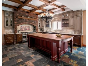 Irpinia Kitchens brought Tuscany to Ottawa with a kitchen makeover that’s rich in distressed cabinets, colourful slate tiles and thick brick wall niche paired with wood ceiling beams to bring depth to the space.