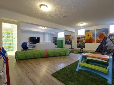 The finished basement in the Charleston (a standard) offers a perfect play area for children. The open TV area could also be enclosed to make another bedroom.