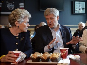 Conservative Leader Stephen Harper talks to a voter at a campaign stop in North Vancouver on Tuesday.