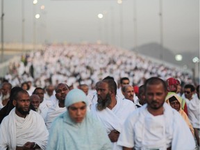 Hundreds of thousands of Muslim pilgrims make their way to cast stones at a pillar symbolizing the stoning of Satan, in a ritual called "Jamarat," the last rite of the annual hajj, on the first day of Eid al-Adha, in Mina near the holy city of Mecca, Saudi Arabia, Thursday, Sept. 24, 2015. Saudi Arabia's civil defense directorate says at least 150 people have been killed in a stampede at the annual hajj pilgrimage.