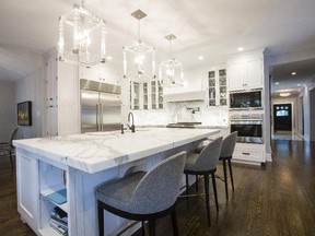 This all-white kitchen on Clemow Avenue features imported marble counters and top-of-the-line stainless appliances.