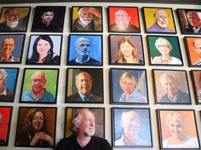 Ottawa artist Philip Craig with a few of more than 150 portraits of people in the city that he's painted to raise money for charity. The portraits are on display to the end of September at Von's restaurant in the Glebe, and at the Ottawa Art Gallery annex in city hall from Oct. 13 to 16.