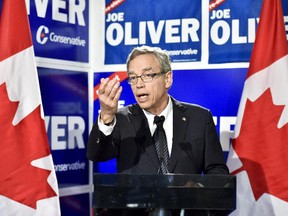 Federal finance minister and Conservative candidate Joe Oliver speaks during a press conference in Toronto on Wednesday, September 30, 2015.