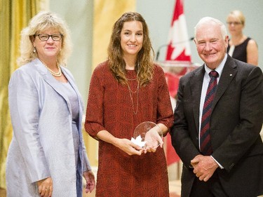 Katie Alexander of Employment and Social Development Canada, center, is congratulated byJanice Charette, clerk of the privy council, left, and David Johnston, Governor General of Canada, right, for receiving the Public Service Award of Excellence for Excellence in Citizen-Focused Service Delivery at Rideau Hall Wednesday September 16, 2015. (Darren Brown/Ottawa Citizen) - Assignment 121627