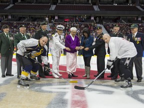 The Korean Ambassador, Jo Daeshik, and the Commander of the Canadian Army, Lieutenant-General Hainse, drop the puck to begin the Imjin Classic hockey game between the Princess Patricia’s Canadian Light Infantry and the Royal 22e Régiment (Vandoos) at the Canadian Tire Centre on September 26, 2015.
Photo by: Cpl Chase Miller
//
Photo no X :
Légende 1
Le 26 septembre 2015, l’ambassadeur de la Corée, Jo Daeshik, et le commandant de l’Armée canadienne, le lieutenant-général Hainse, effectuent la mise au jeu protocolaire du match de hockey Imjin Classic qui oppose le régiment Princess Patricia’s Canadian Light Infantry et le Royal 22e Régiment au centre Canadian Tire.
Photo : Cpl Chase Miller