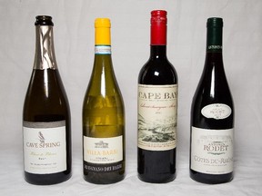 (Left to right) Cave Spring Blanc de Blanc, Villa Barbi Orvieto, Cape Bay Cabernet Sauvignon - Shiraz, Antonin Rodet Cotes Du Rhone, a selection of wine bottles for Rod Phillips wine column. Assignment - 121383 Photo taken at 09:31 on August 18. (Wayne Cuddington/ Ottawa Citizen)