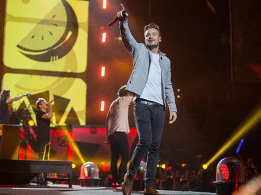 Liam Payne acknowledges the crowd as the band One Direction takes to the stage at Canadian Tire Centre on Tuesday night.
