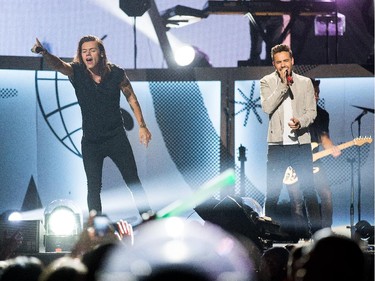 Liam Payne (R) and Harry Styles (L) belt out the tunes as the band One Direction takes to the stage at Canadian Tire Centre on Tuesday night.