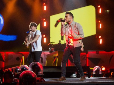 Liam Payne (R) and Louis Tomlinson belt out the tunes as the band One Direction takes to the stage at Canadian Tire Centre on Tuesday night.