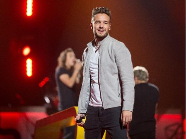 Liam Payne smiles at the crowd as the band One Direction takes to the stage at Canadian Tire Centre on Tuesday night.