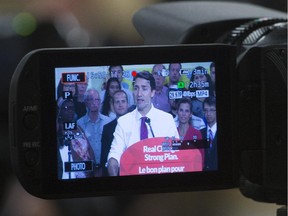 Liberal leader Justin Trudeau is framed by a video camera as he makes an announcement in Toronto on Wednesday, September 9, 2015.