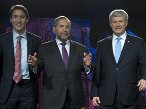 Liberal Justin Trudeau, NDP Leader Tom Mulcair and Conservative leader Steven Harper pose for a photo prior to the Globe and Mail hosted  leaders' debate in Calgary Thursday, Sept, 17, 2015.
