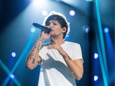 Louis Tomlinson sings as the band One Direction takes to the stage at Canadian Tire Centre on Tuesday night.