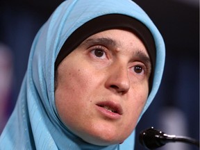 Monia Mazigh, wife of Syrian born Canadian Mahar Arar, reads a statement for her husband at a news conference in Ottawa Tuesday September 1, 2015.