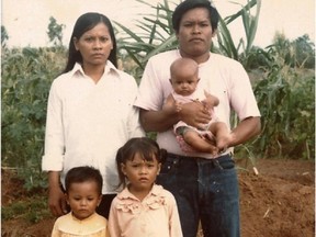 Letter-writer Sophy Munro (baby in father's arms) with her family, the Chhiv family: Mother Pho, father Sophon, sister (left) Sophanny, and sister (right) Sophanna. Munro was born in a refugee camp in Thailand.