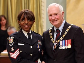Staff Sgt. Isobel Granger, of the Ottawa Police Service, is invested as Member to The Order of Merit of the Police Forces by Governor General David Johnston during a ceremony at Rideau Hall,  Friday Sept. 18, 2015.