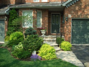 To make a strong first impression, boost your home's curb appeal with colourful plants and pruned shrubs.