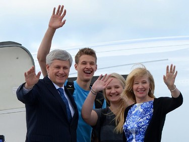 Conservative Leader Stephen Harper, wife Laureen and son and daughter Ben and Rachel wave as they arrive  in Quebec City for a rally while on the campaign trail on Sunday, August 9, 2015. Canadian's will head to the polls on Oct 19, 2015.
