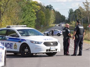 Stonecrest Rd is blocked off as police conduct a search for a gunman in the area of Kinburn Side Road and Stonecrest Rd.