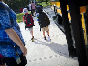 Students get off the bus and head to meet up with their friends on the first day back to school at Bayview Public School.