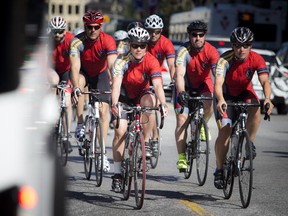 Ottawa Police officers lead the group of cyclists down Wellington and up onto Parliament Hill to complete the 640 km ride to Ottawa from the Ontario Police College (OPC) in Aylmer, Ontario.