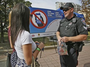 The Ottawa Police Sgt. Dennis Hull talks to uOttawa students about the importance of abstaining from texting while driving during the Leave the Phone Alone campaign Tuesday September 08, 2015.