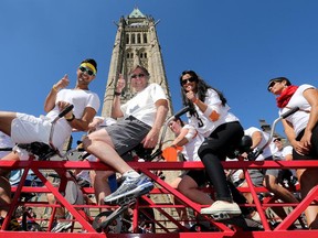 Thirty public servants (including Deputy Minister of Justice, Bill Pentney, centre, jumped aboard a tandem bike Tuesday.