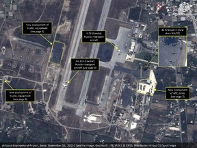 This September 2015 satellite image with annotations provided by GeoNorth, AllSource Analysis, Airbus shows Russian transport aircraft, helicopters, tanks, trucks and armed personnel carriers at an air base in Latakia province, Syria. Russia on Thursday, Sept. 17, strongly urged the United States and its allies to engage the Syrian government as a "partner" in the fight against the Islamic State group, and offered to share any information about its military supplies to Damascus with Washington.
