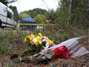 Two bouquets of flowers left near murder scene at 37 Szczipior Rd. in Wilno on Wednesday, September 23, 2015, where Anastasia Kuzyk was killed.