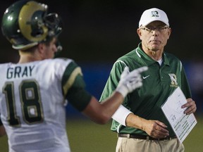 University of Regina Rams head coach Mike Gibson speaks with Frankie Gray (18) during CIS Canada West football action against the UBC Thunderbirds in Vancouver.