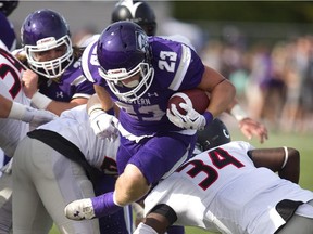 Western's Adam Sinclair bursts through an exhausted Carleton defence for a touchdown on Saturday, Sept. 26, 2015.