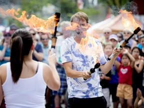 A busker had the crowd entertained while he juggled fire at Westfest Saturday June 13. The weekend festival  took over the streets of Westboro.
